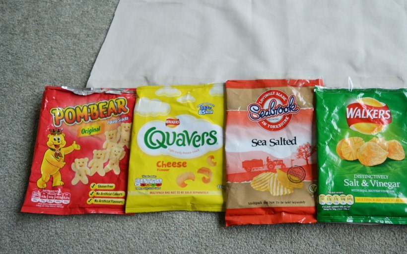 Sellotape crisp packets into place