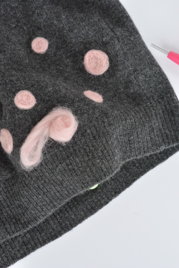 Repair moth holes in a sweater with needle felt
