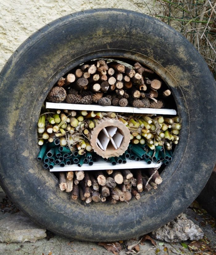 Use a former tyre to create a fun DIY Bug Hotel hoe to make your own but hotel on the blog