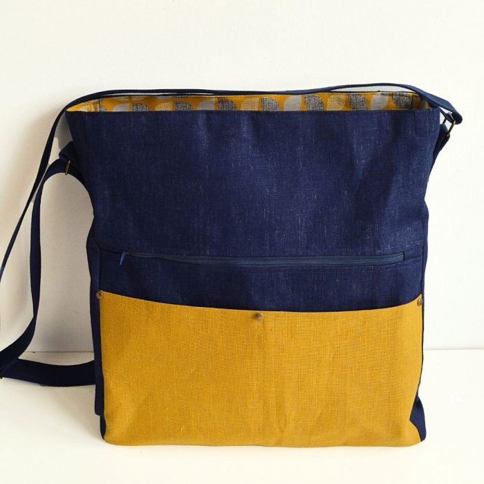 Enjoy filling up the large size waxed canvas crossbody bag, or choose to make the medium size for everyday use. With many pockets this bag closes with a recessed zipper. This free pattern includes written and video instructions.